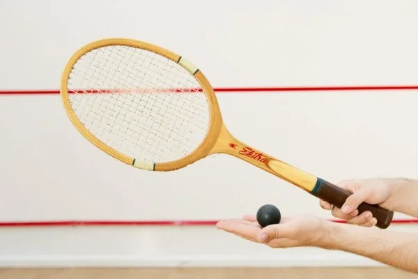 squash racket and ball closeup